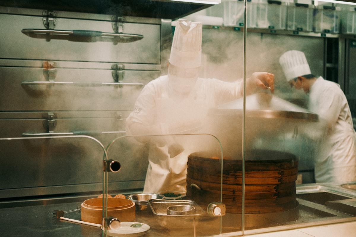 Steaming vegetables in basket over hot water